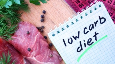 A scribble pad on which is written the phrase "Low-Carb Diet".