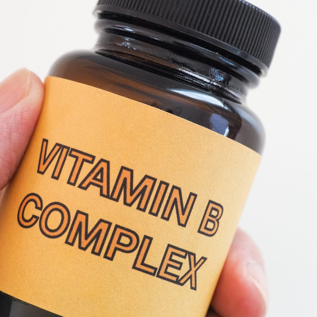 A bottle of Vitamin B Complex supplements.