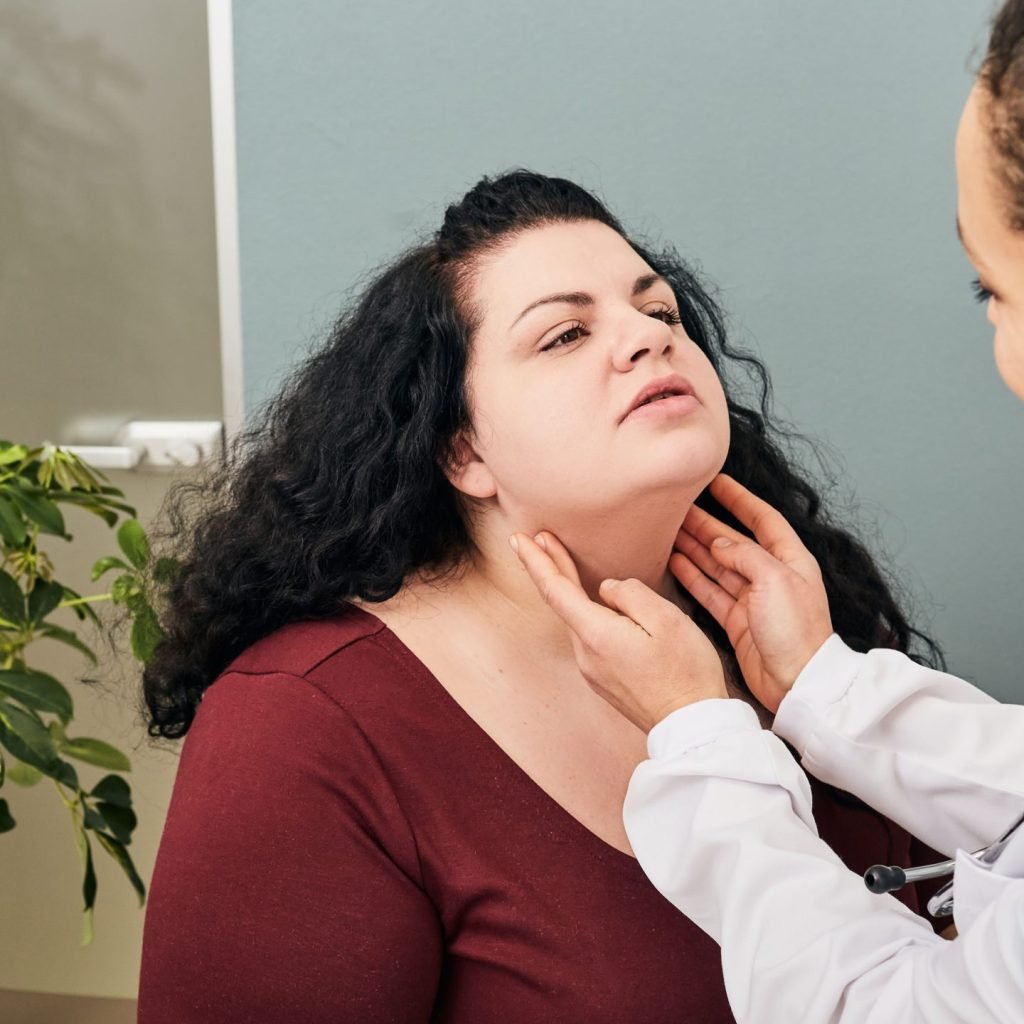 A woman is being examined for Hypothyroidism.